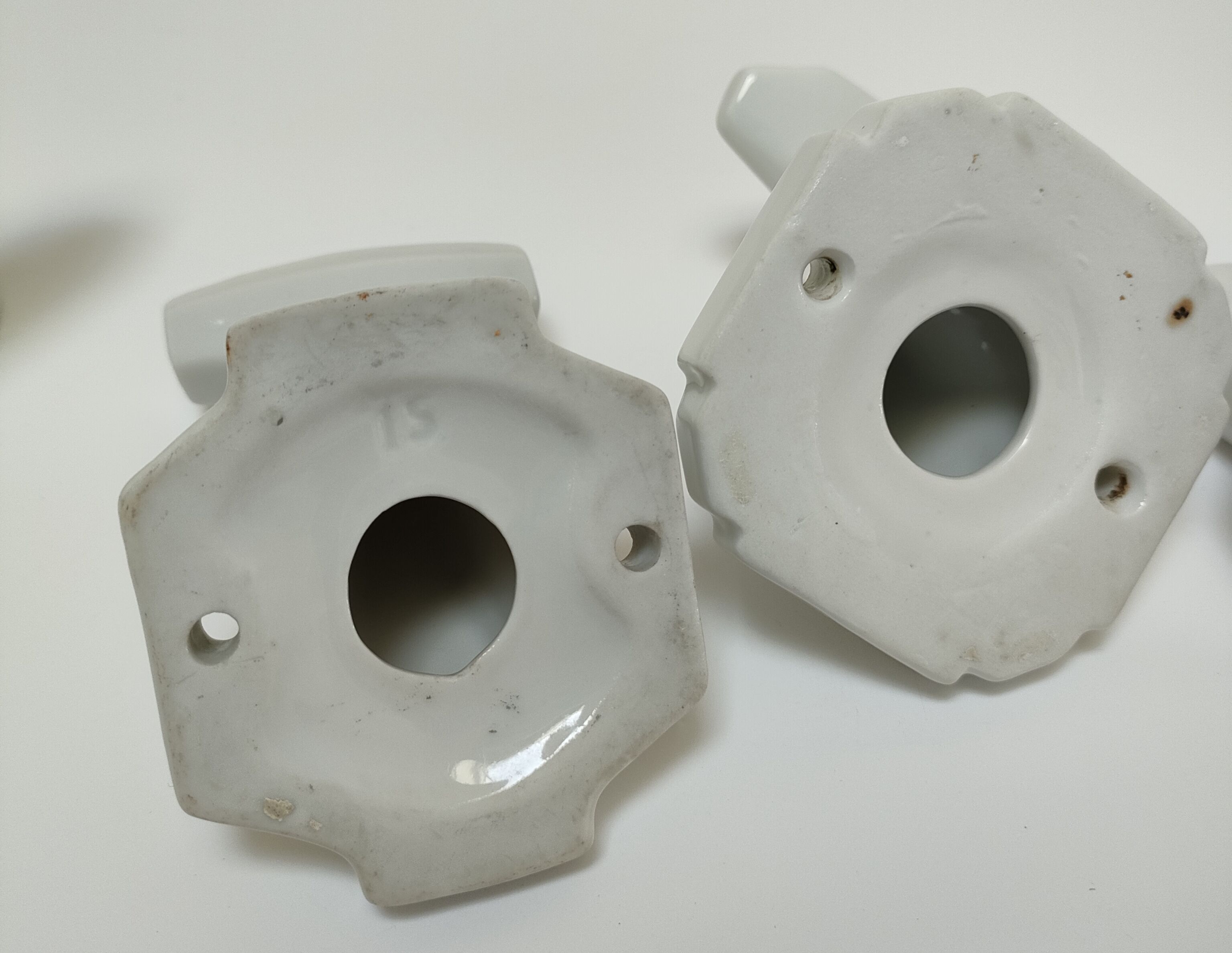 Five art deco white porcelain hooks