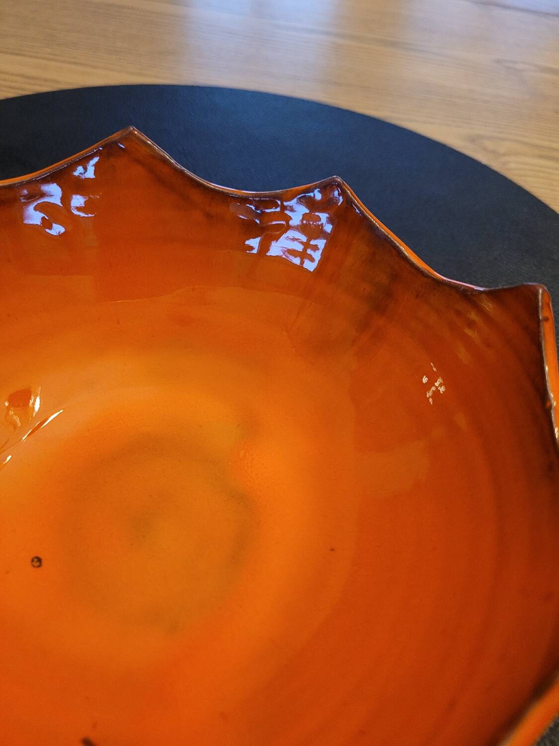 Orange ceramic star-shaped empty bowl