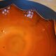Orange ceramic star-shaped empty bowl