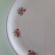 Flat earthenware plates with gilded edges