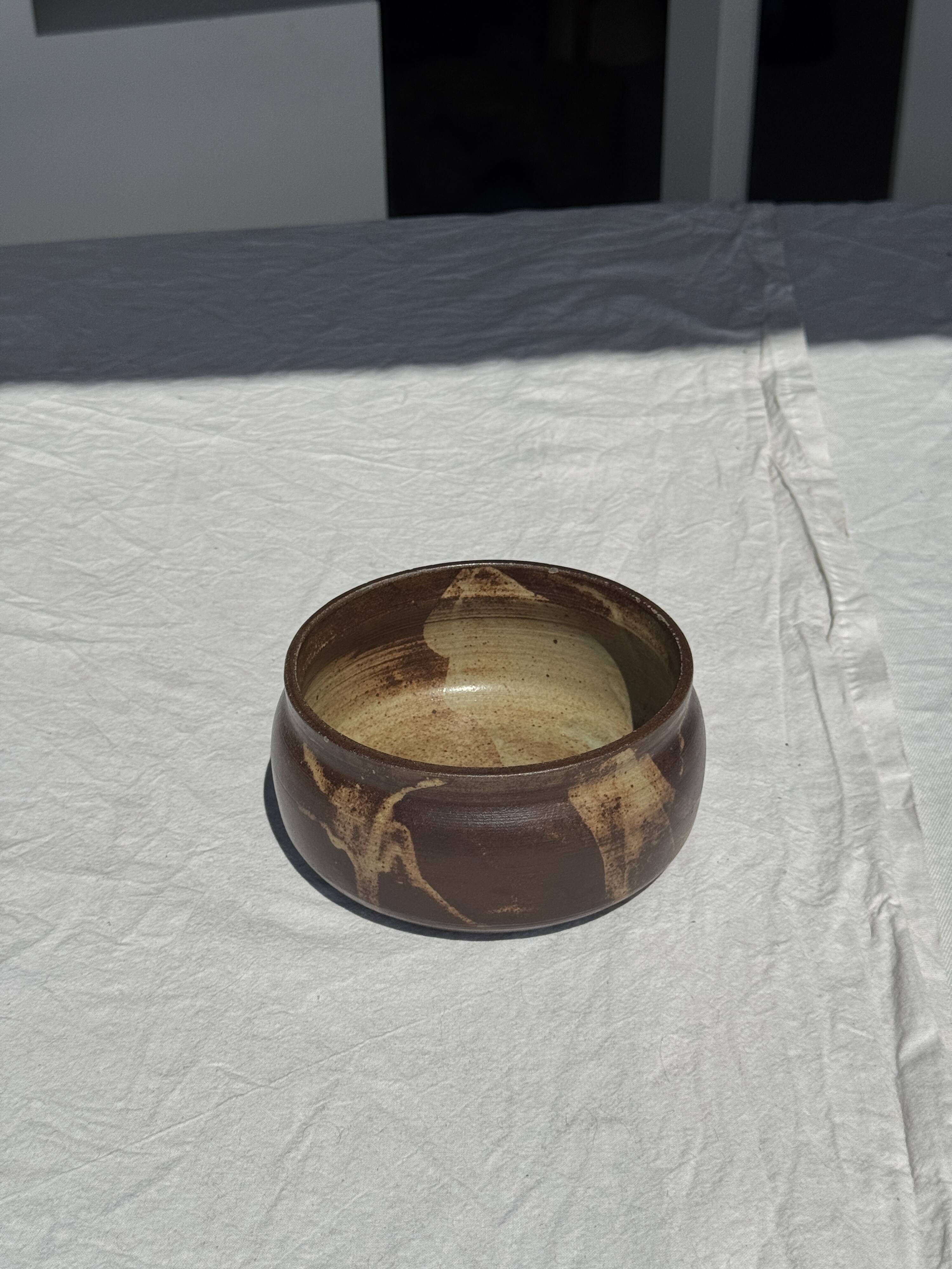 A small stoneware bowl, brown exterior, speckled grey interior D15