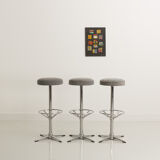 Trio of bar stools with restored seating and chrome-plated steel legs