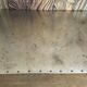Riveted metal industrial coffee table, Jansen style