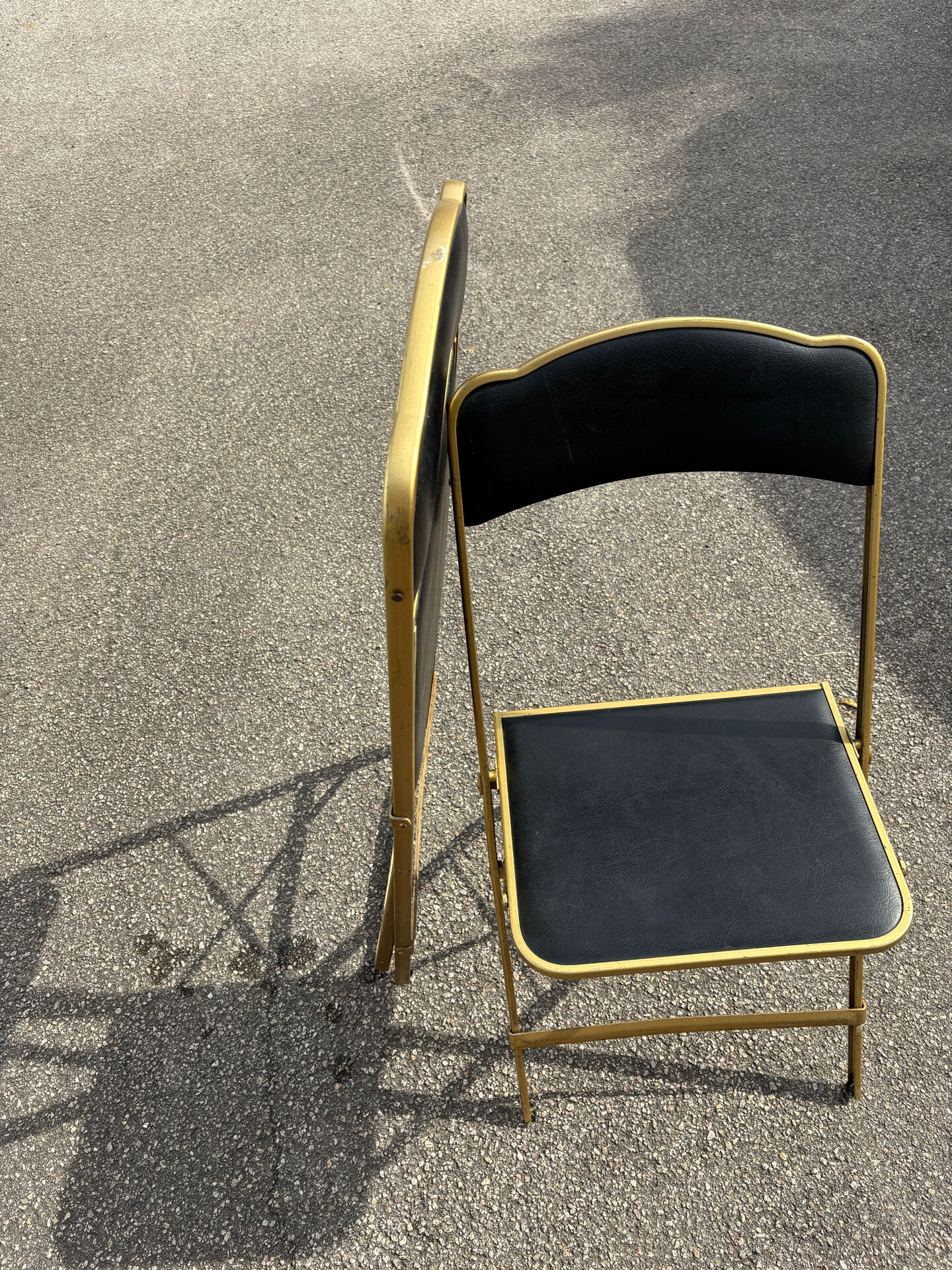 Two chairs, similar black