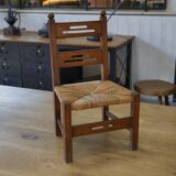 Children's wooden chair with straw seat