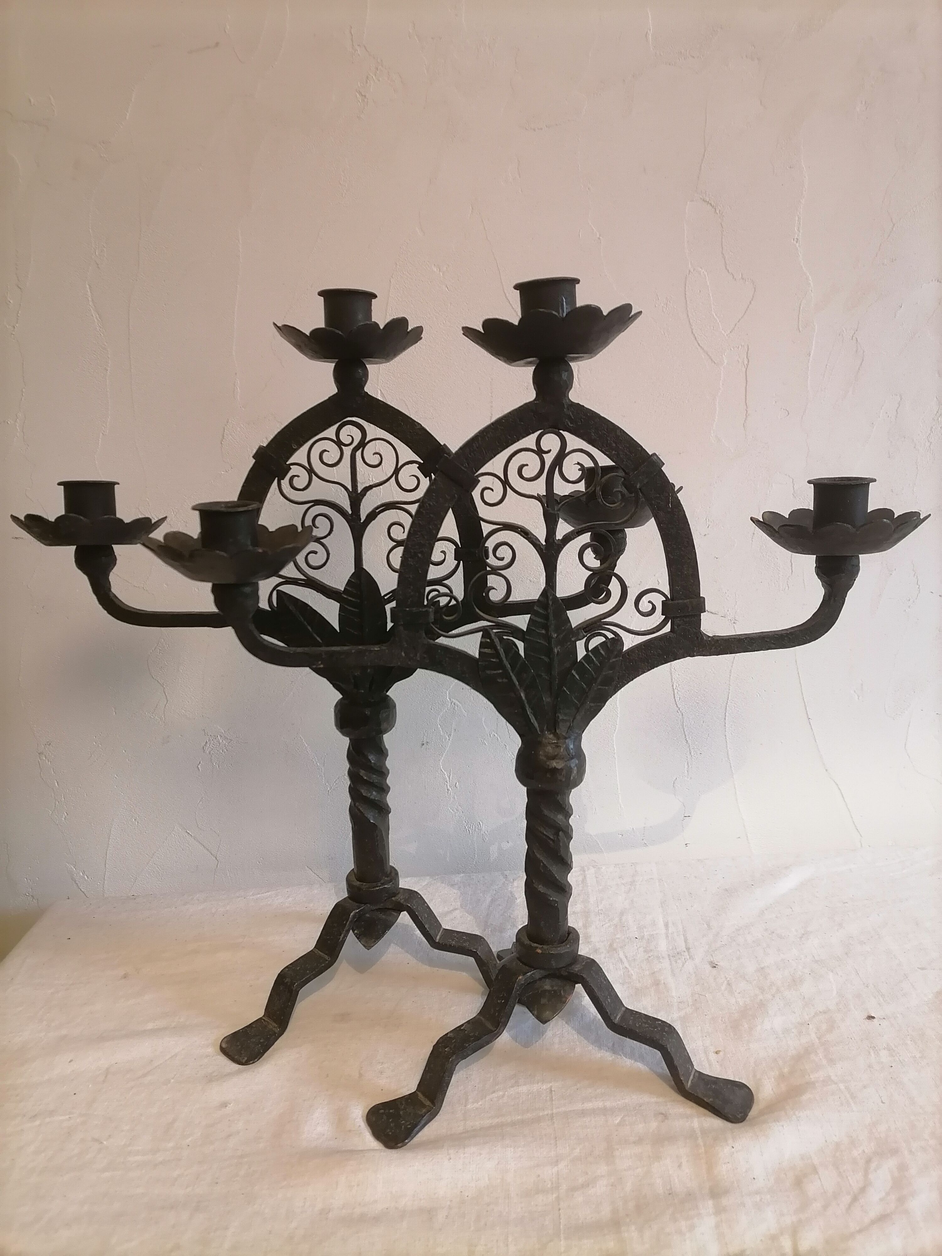 Pair of wrought iron candelabras. Mid-twentieth century.