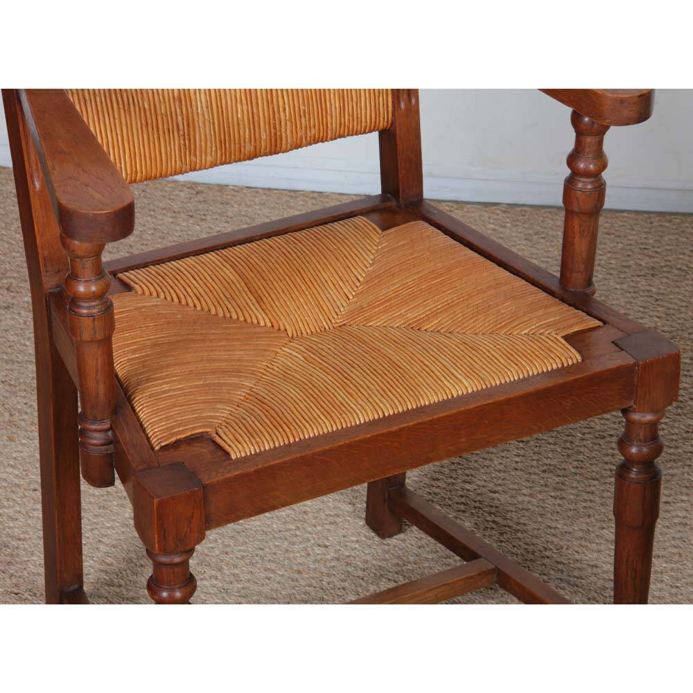Pair of oak straw-seated armchairs from the 1950s.