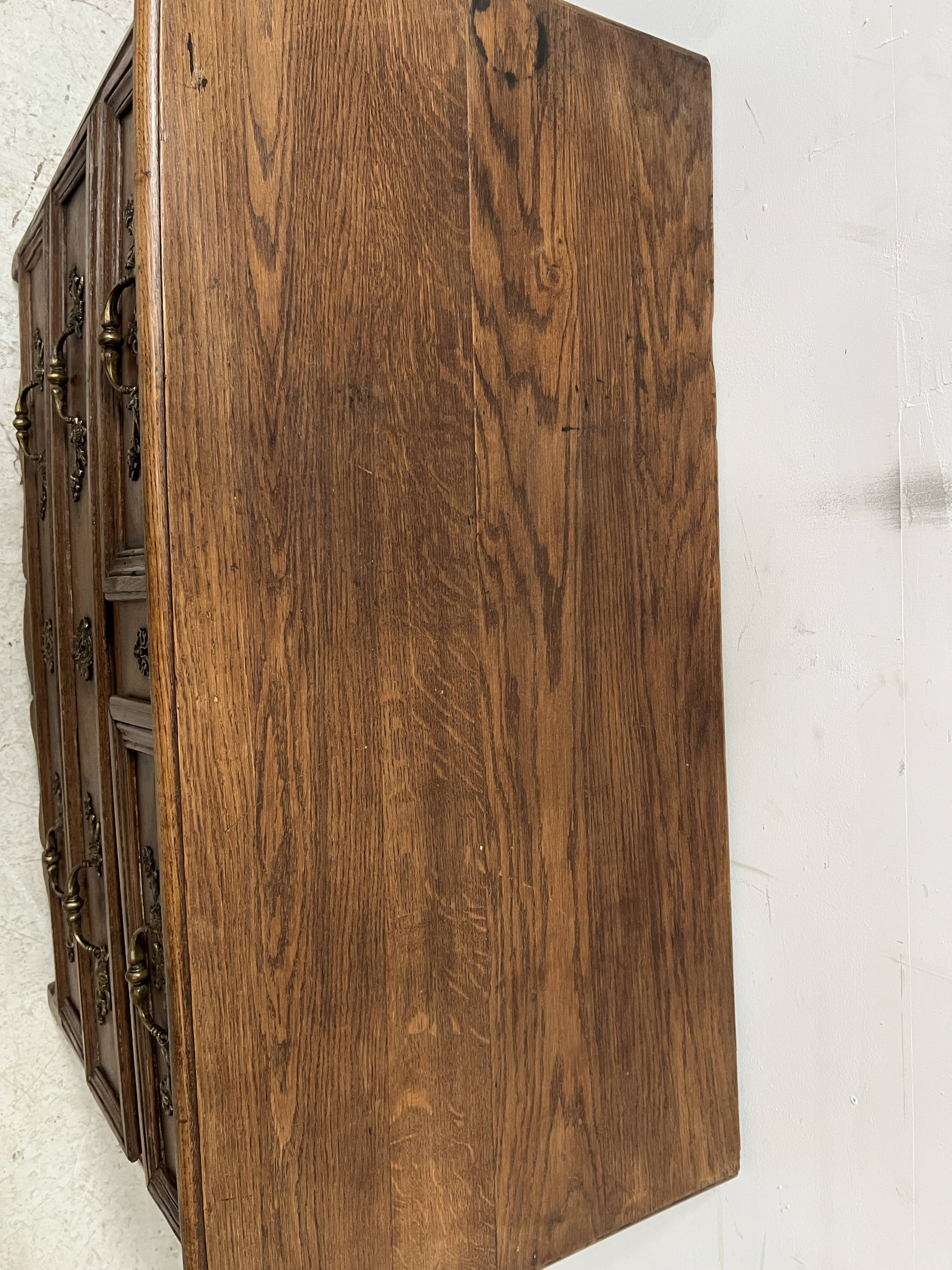 Louis XIV style chest of drawers in solid oak, 18th century