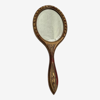 Miroir biseauté face à main entourée de bois dimension : hauteur -38cm- largeur -15,5cm-