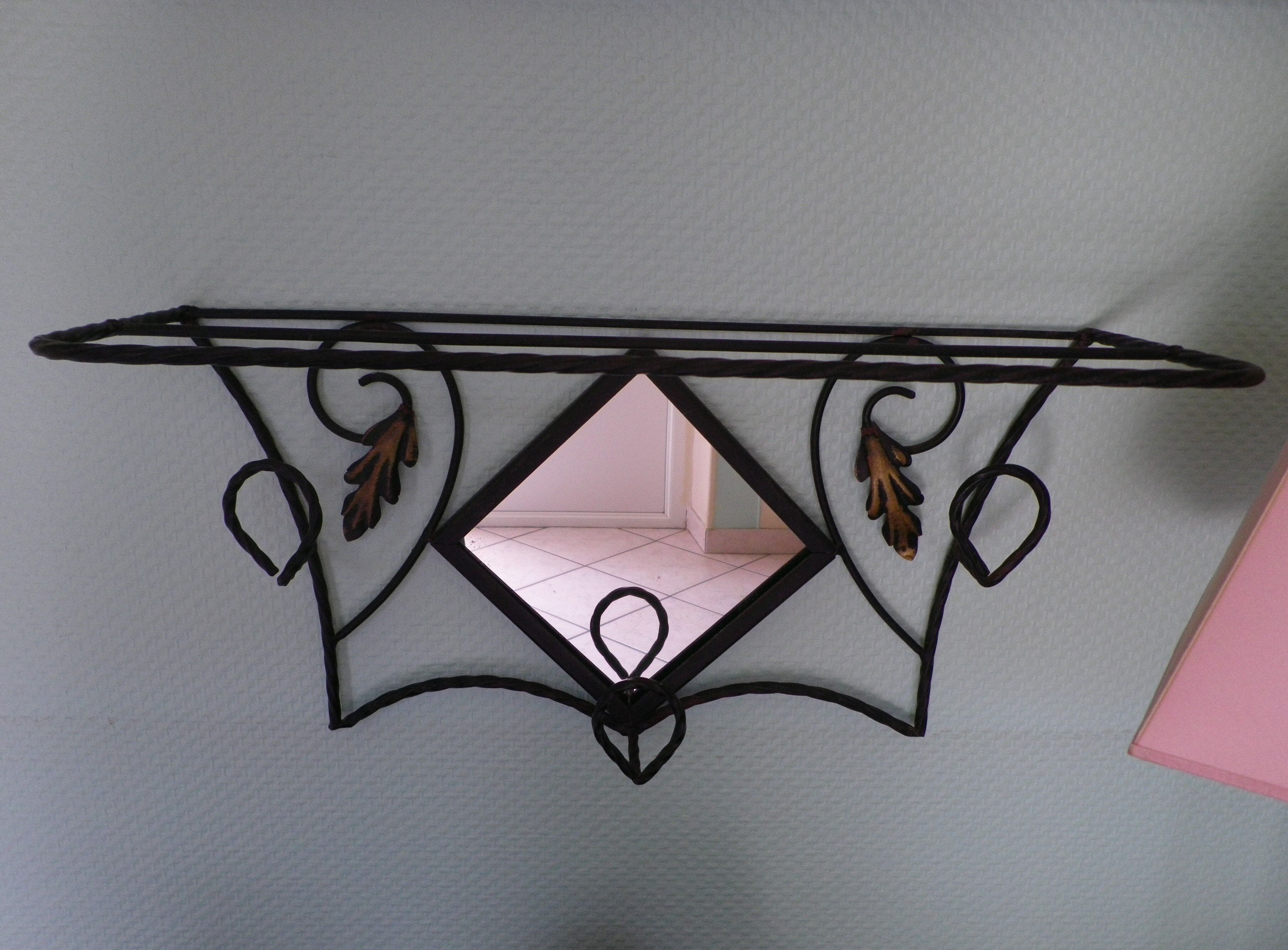 Wrought iron wall holder with top support and built-in mirror