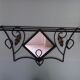 Wrought iron wall holder with top support and built-in mirror