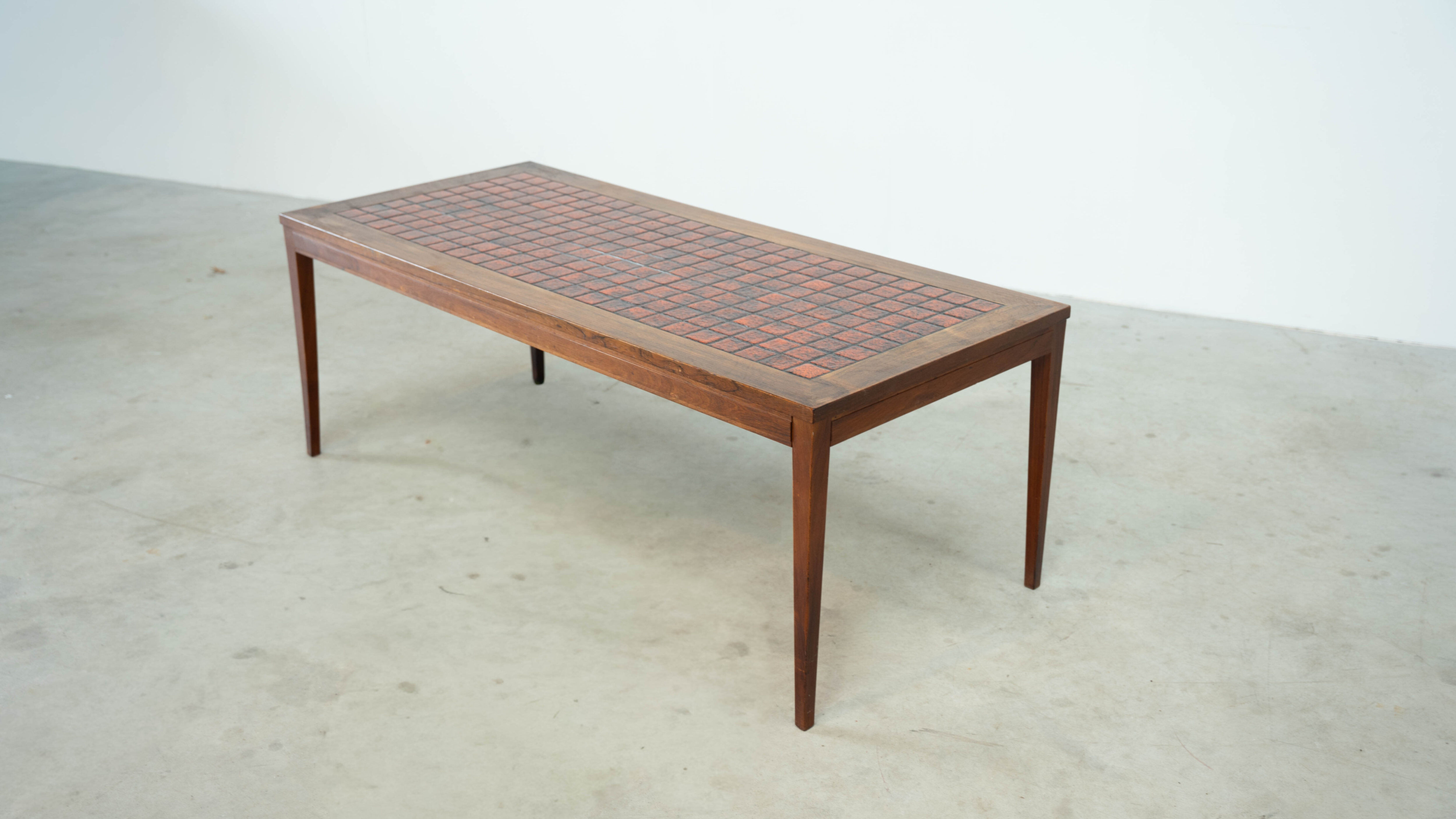 Danish red ceramic and teak coffee table