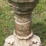Holy water font on stone column (17th century)