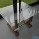 Art Deco coffee table in glass, wood, and brass.