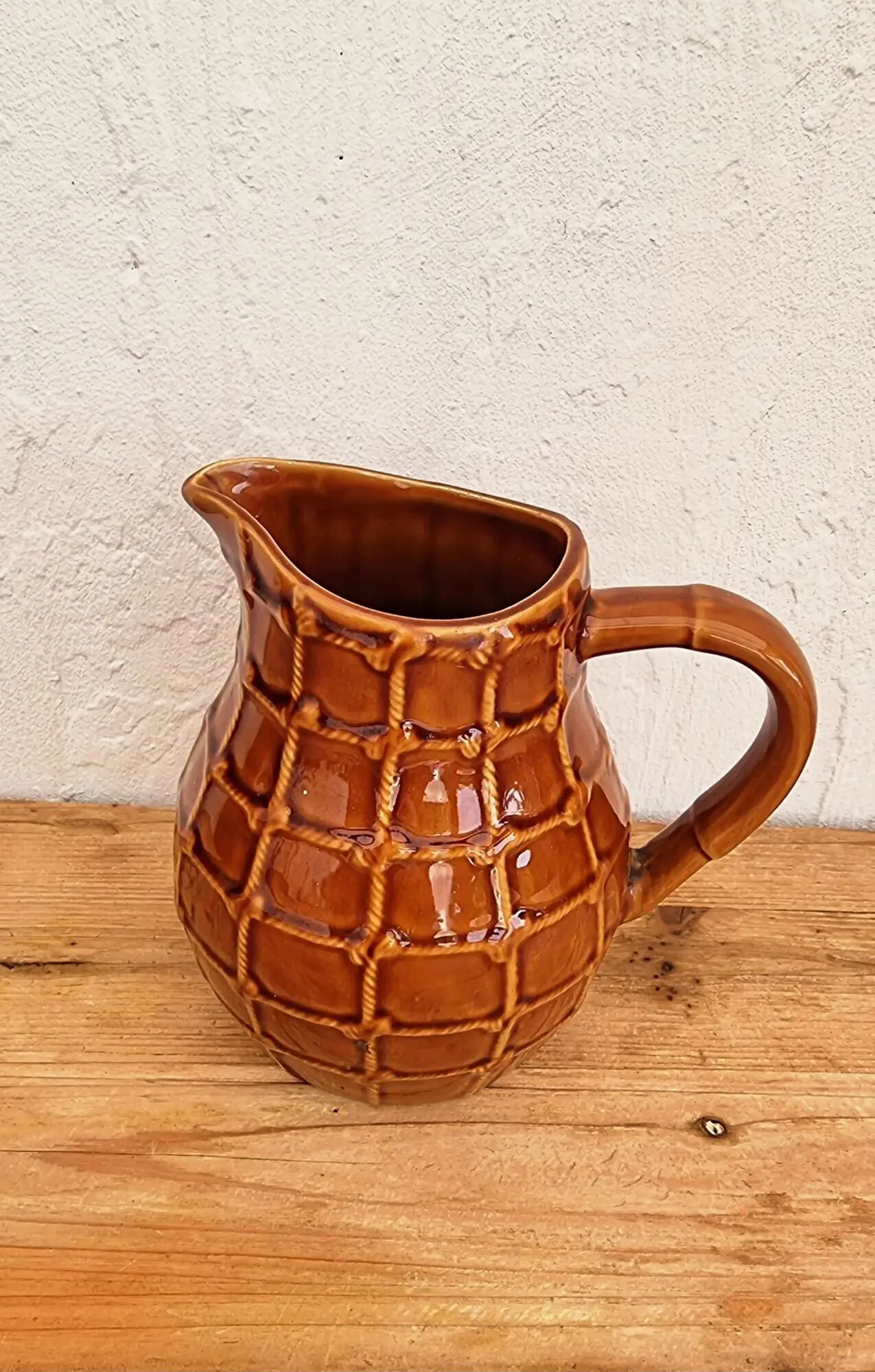 Vintage Saint Clément pitcher with a caramel checkered design.