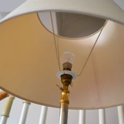 Vintage extendable tripod floor lamp in gold brass.
