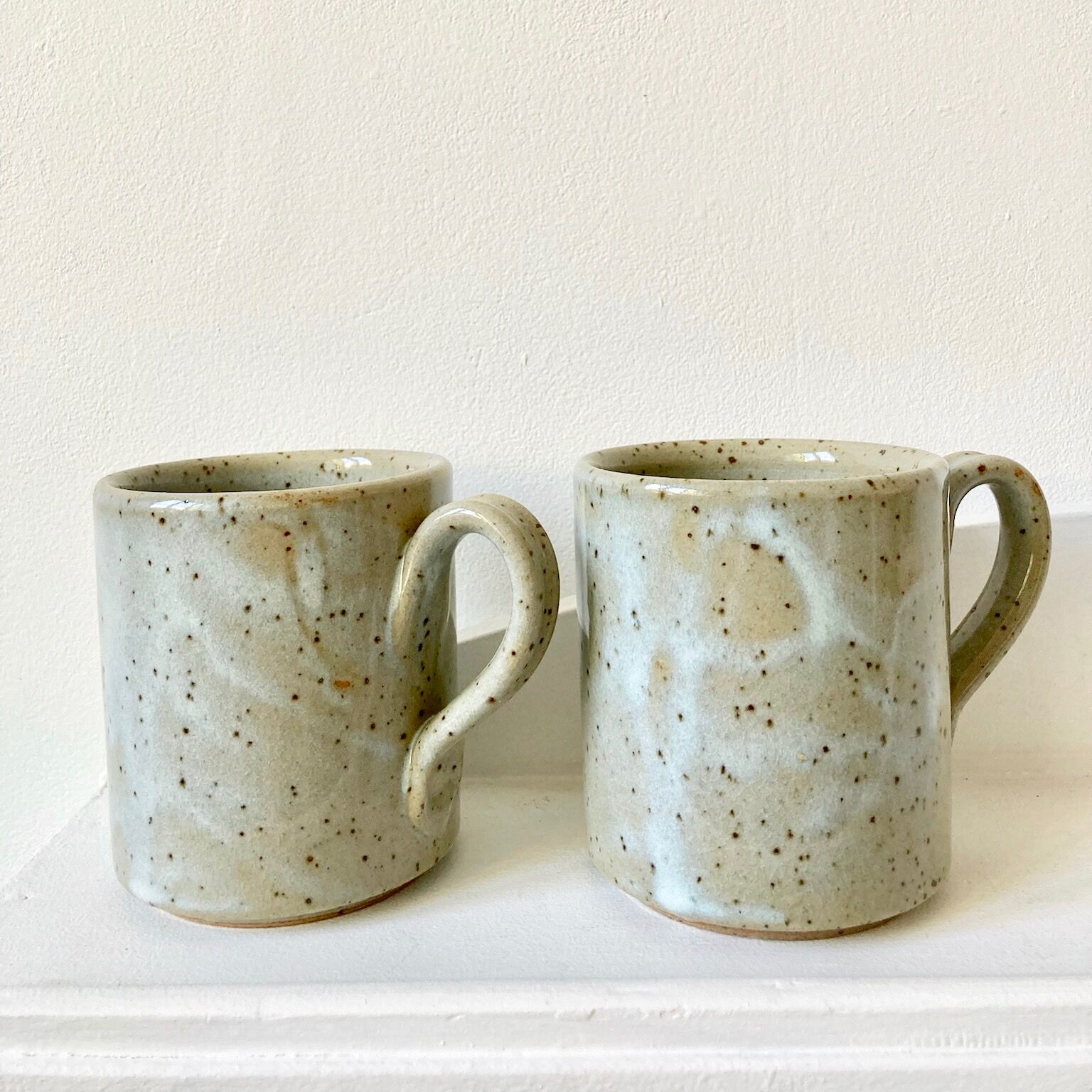 Pair of enamelled stoneware mugs