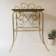 Bedside table in gold metal and black glass