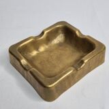 Empty pocket brutalist-inspired ashtray in gilded bronze