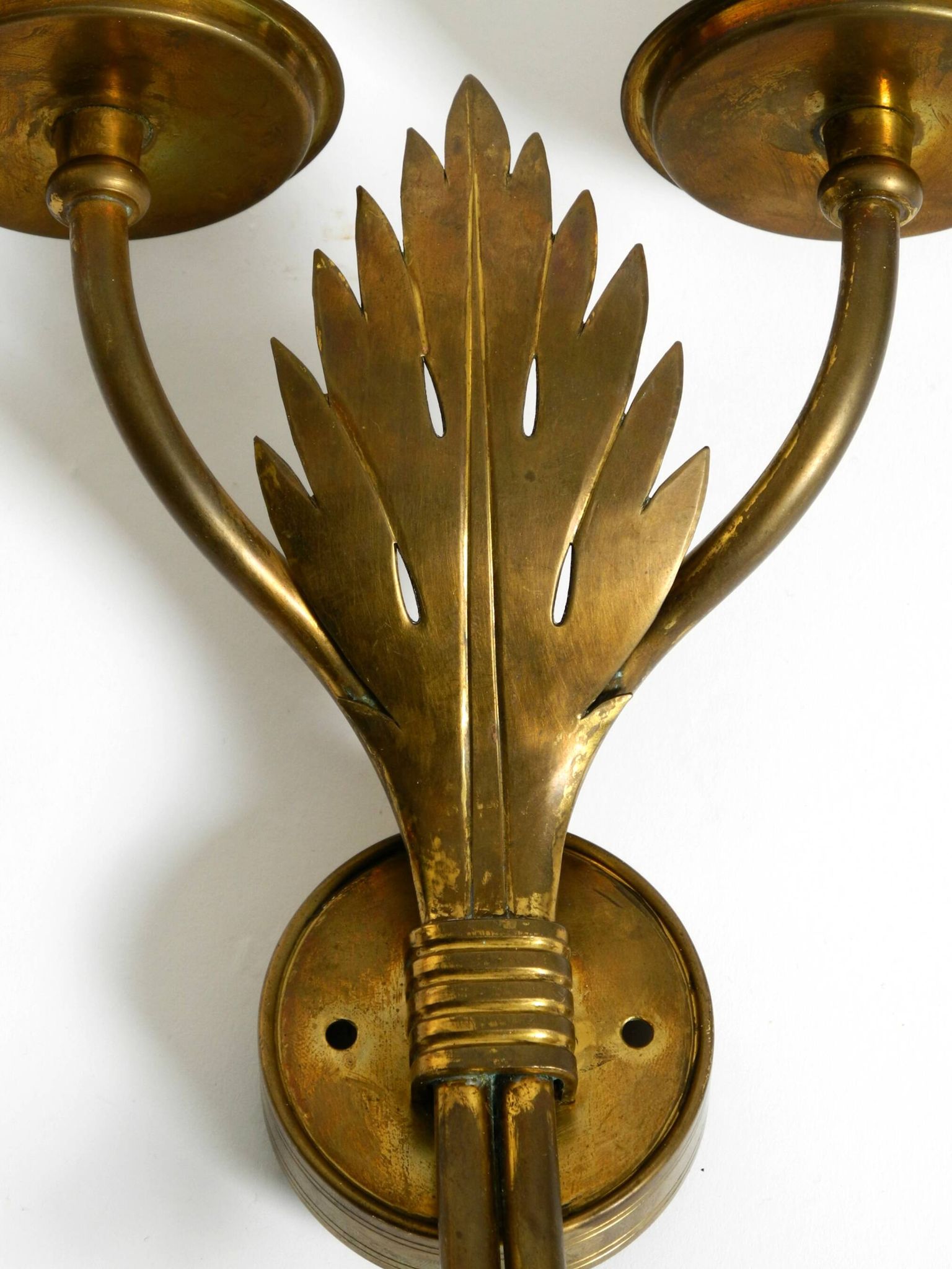 A pair of mid-century modern brass wall lamps by Vereinigte Werkstätten