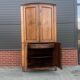 Louis Seize Oak corner cabinet with a quarter curved front