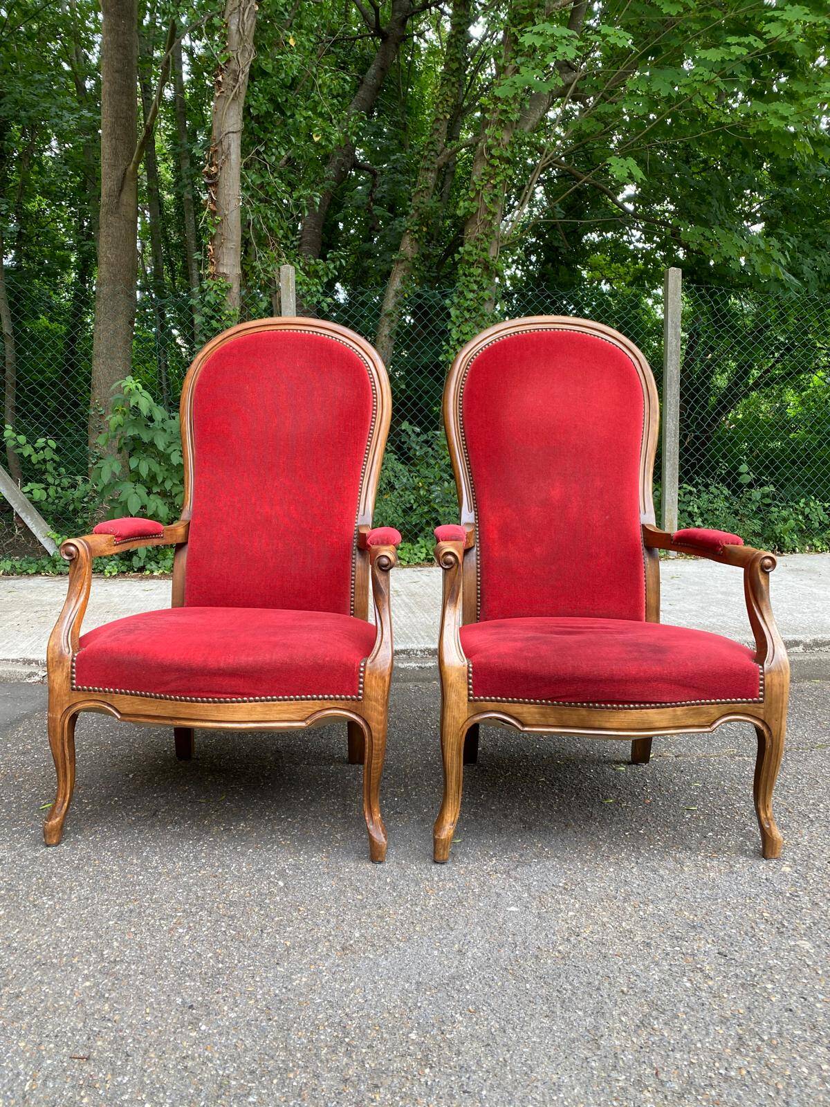 2 Louis Philippe cabriolet armchairs in burgundy velvet wood from the 19th century.