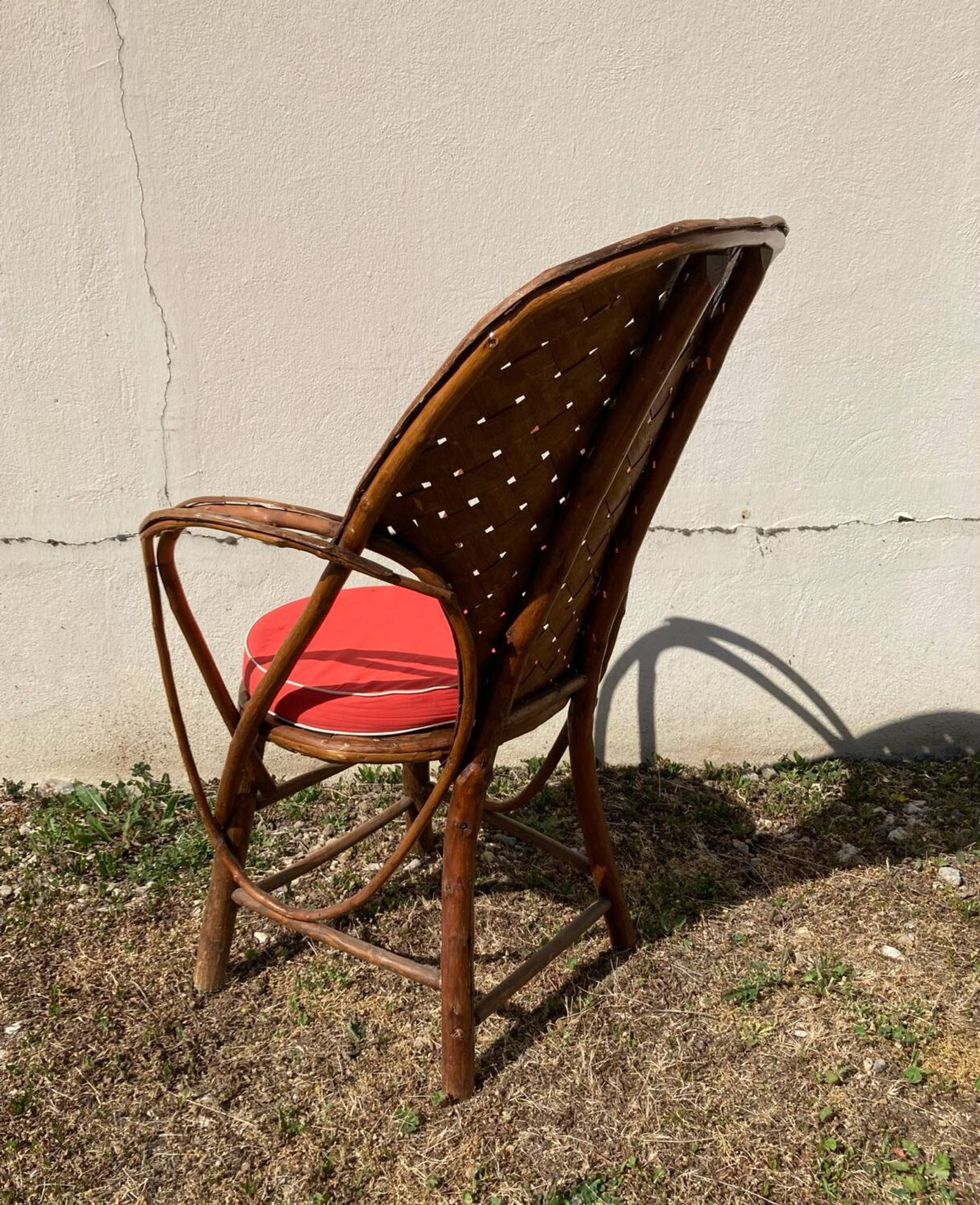Vintage 1970s armchair in curved woven chestnut + seat cushion