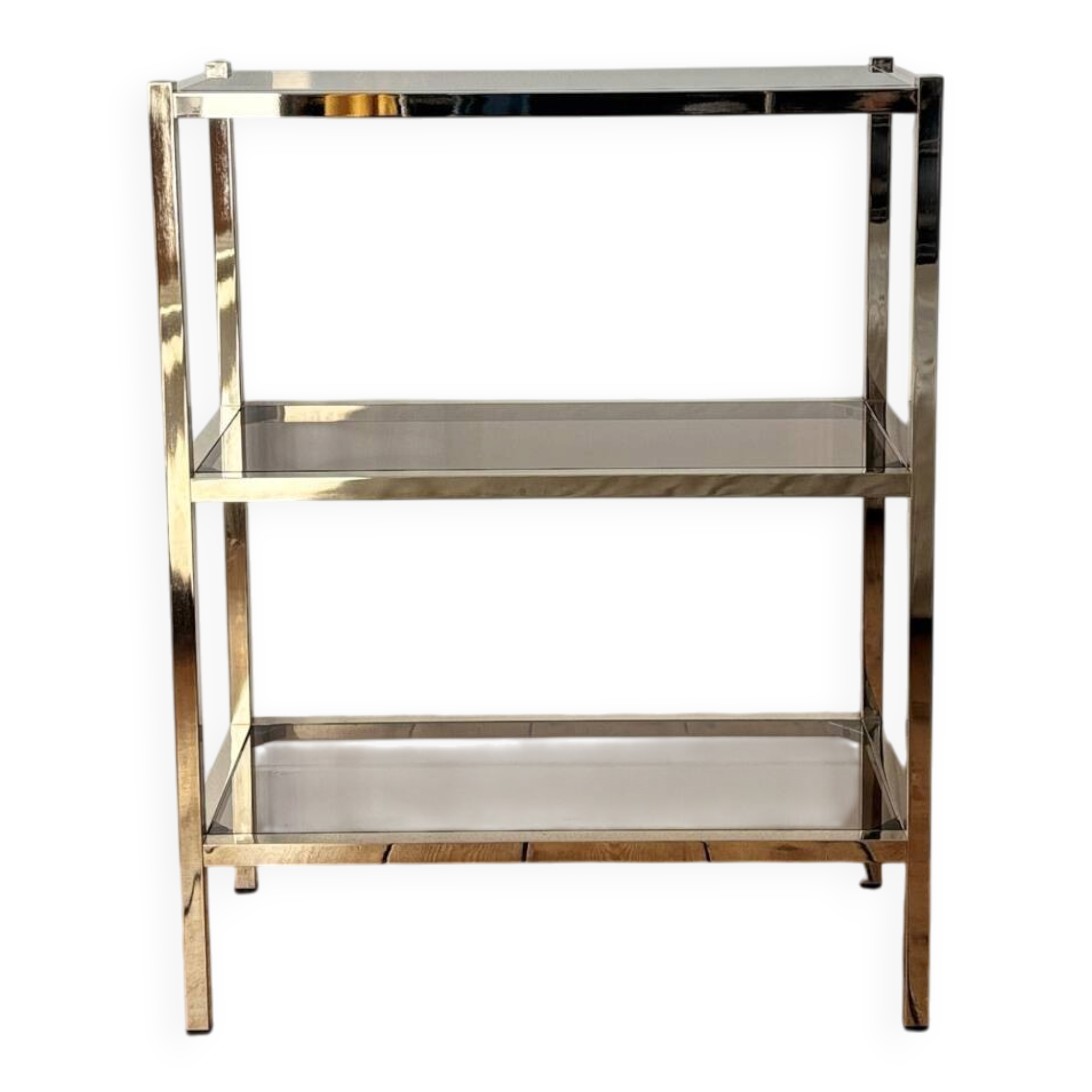 Library shelves in brass and smoked glass