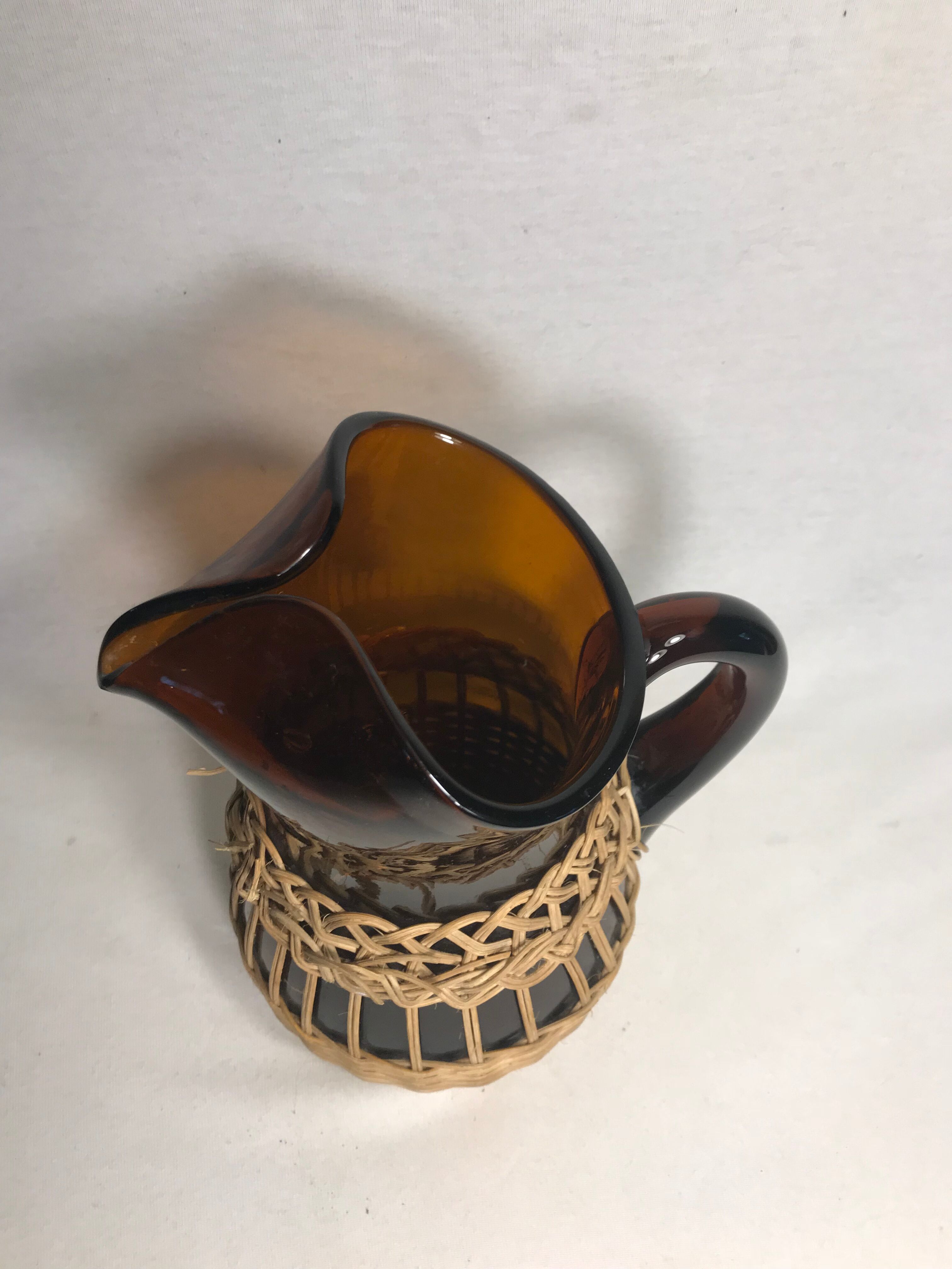 Service old juice carafe and its 9 orange glasses