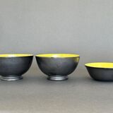 Two pitchers and three Elchinger ceramic bowls black and yellow background 1960