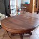 Old table slightly oval cherry tree with central foot with 2 extensions