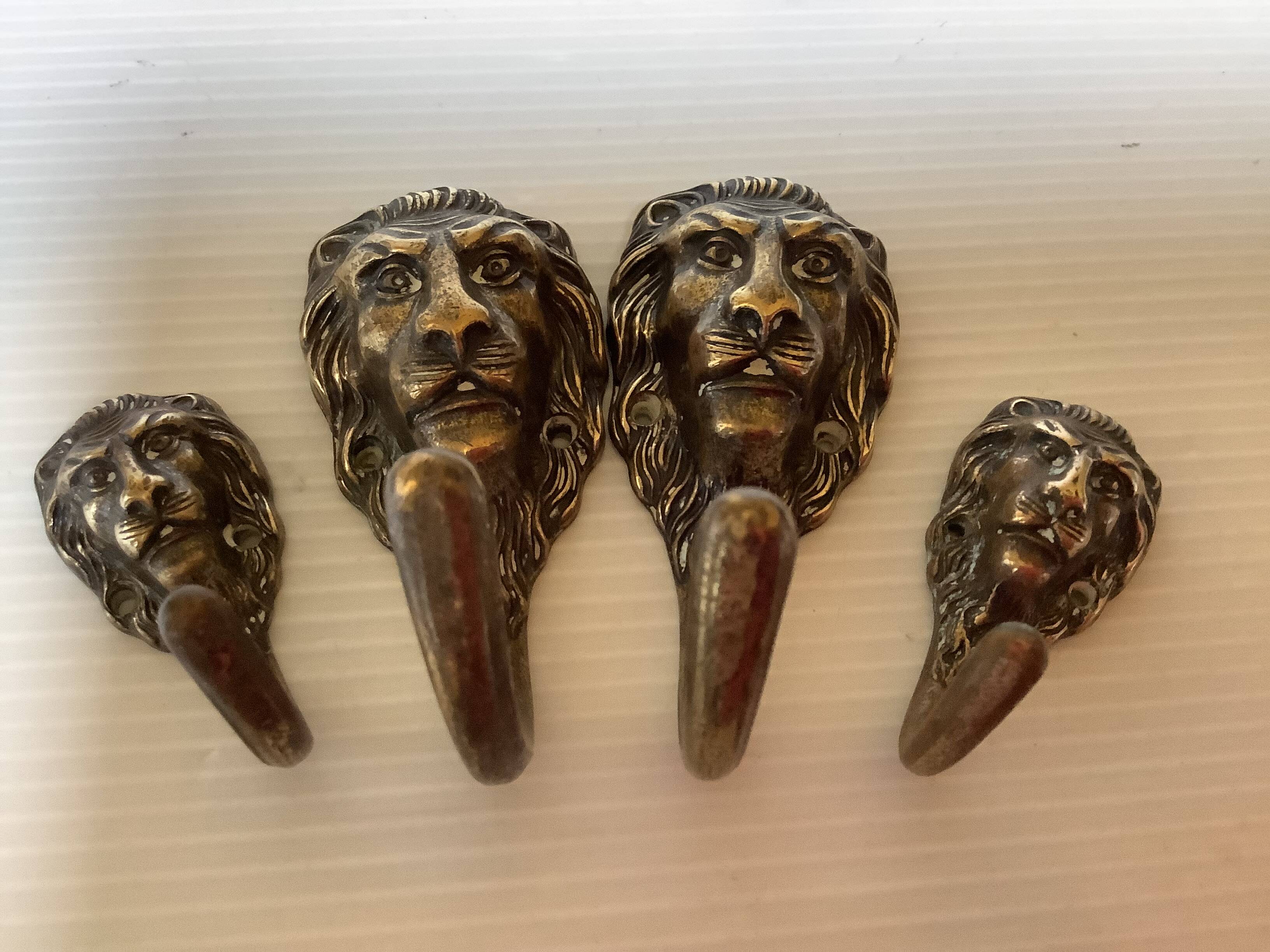 4 lion coat hooks in brass