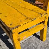 Old yellow teak school bench