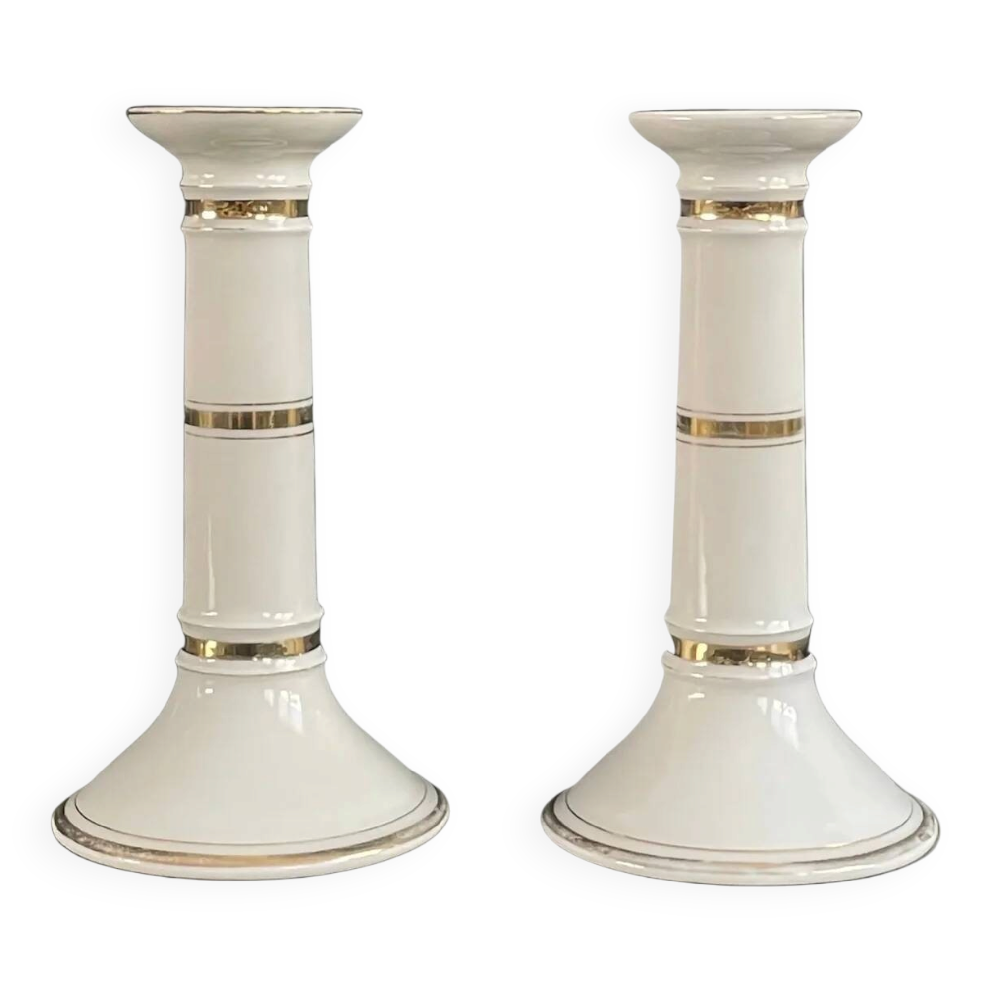 Pair of porcelain candlesticks with a gold pattern.