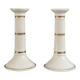 Pair of porcelain candlesticks with a gold pattern.