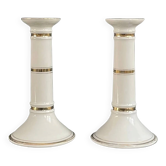 Pair of porcelain candlesticks with a gold pattern.
