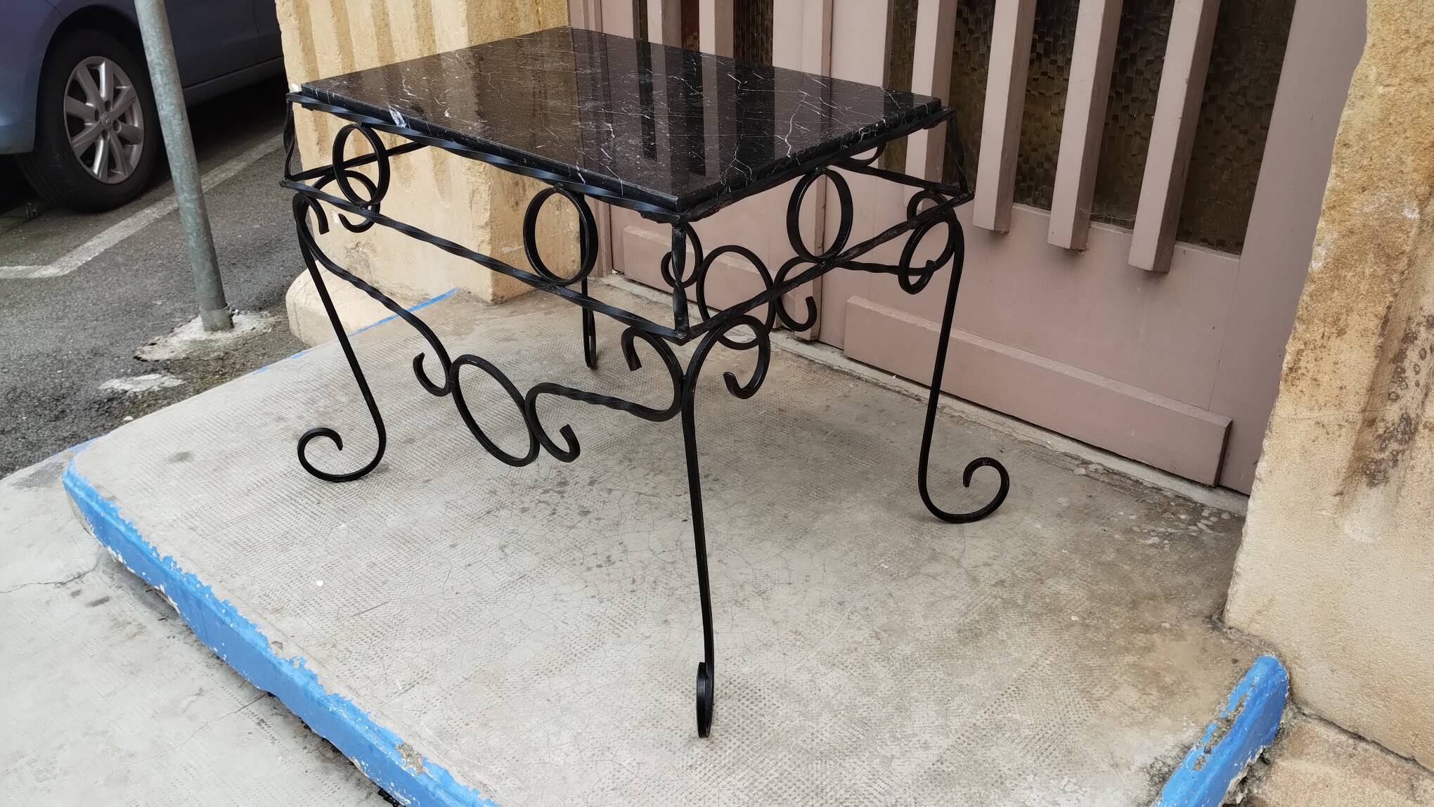 Wrought iron coffee table with black marble top