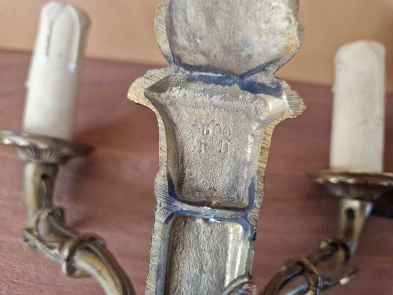 Pair of Empire style wall sconces in gilded bronze and green lacquer.