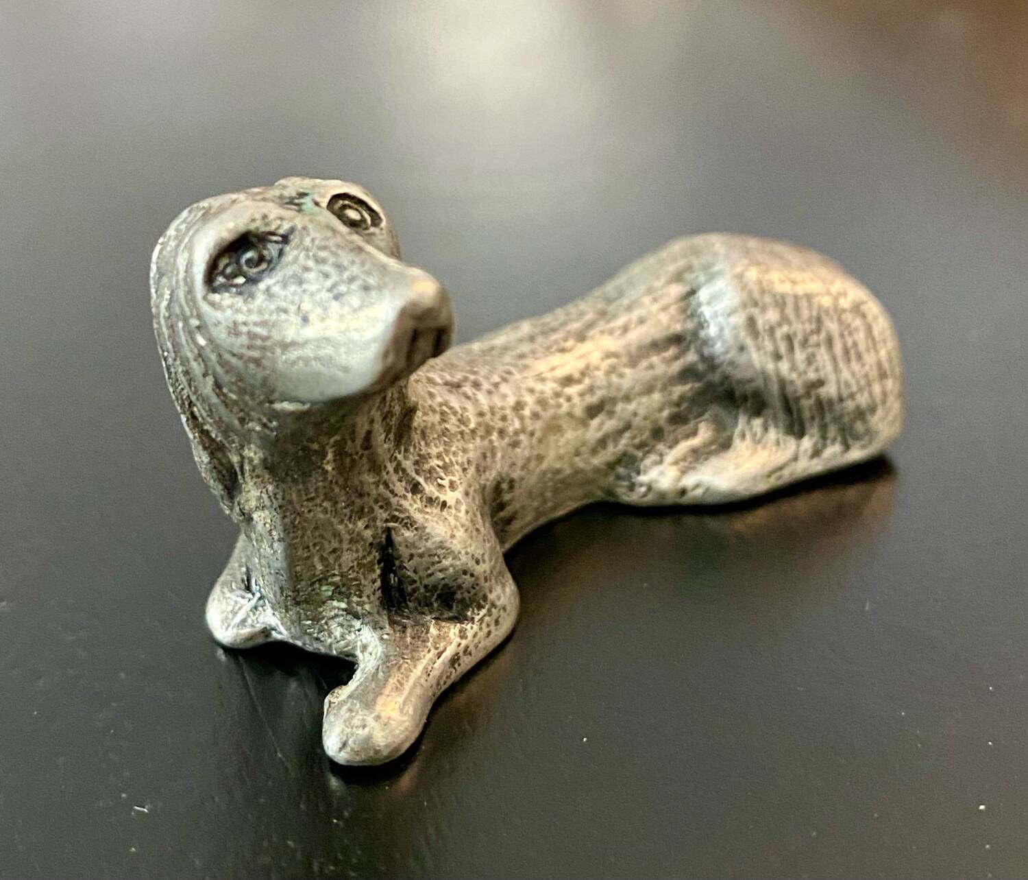 12 old dog-shaped Etains du Manoir knife holders