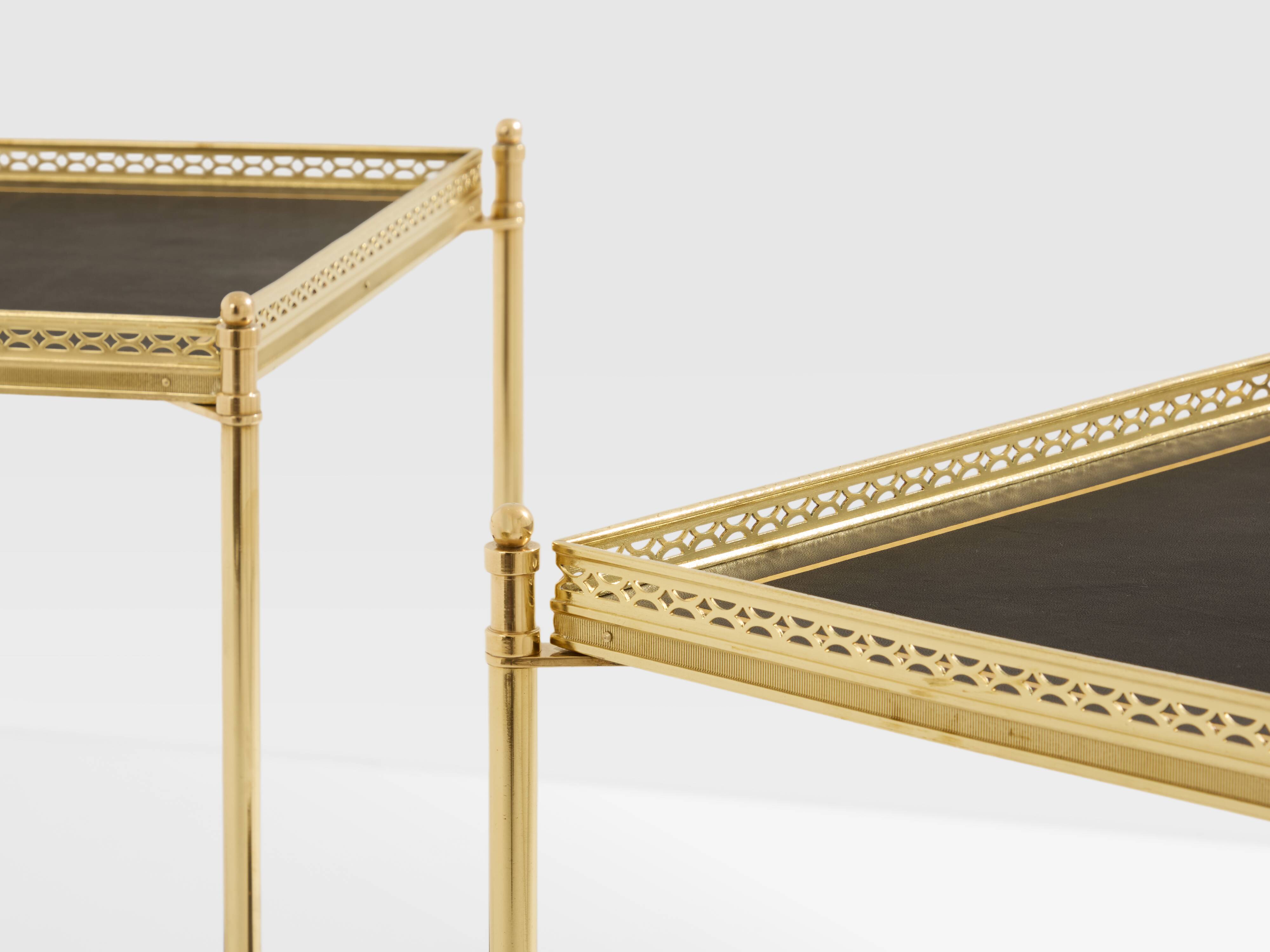 Pair of neoclassical side tables in brass and black leather by Maison Jansen, 1960.