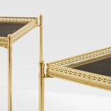 Pair of neoclassical side tables in brass and black leather by Maison Jansen, 1960.