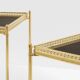 Pair of neoclassical side tables in brass and black leather by Maison Jansen, 1960.