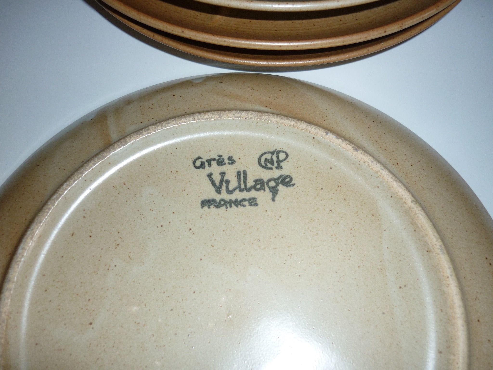 Pair of CNP Village stoneware fondue-raclette plates