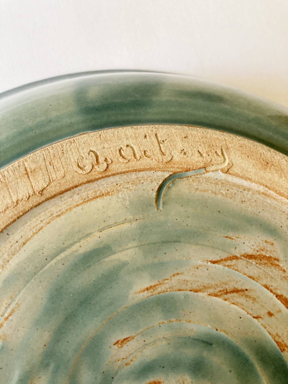 Celadon green stoneware dish signed