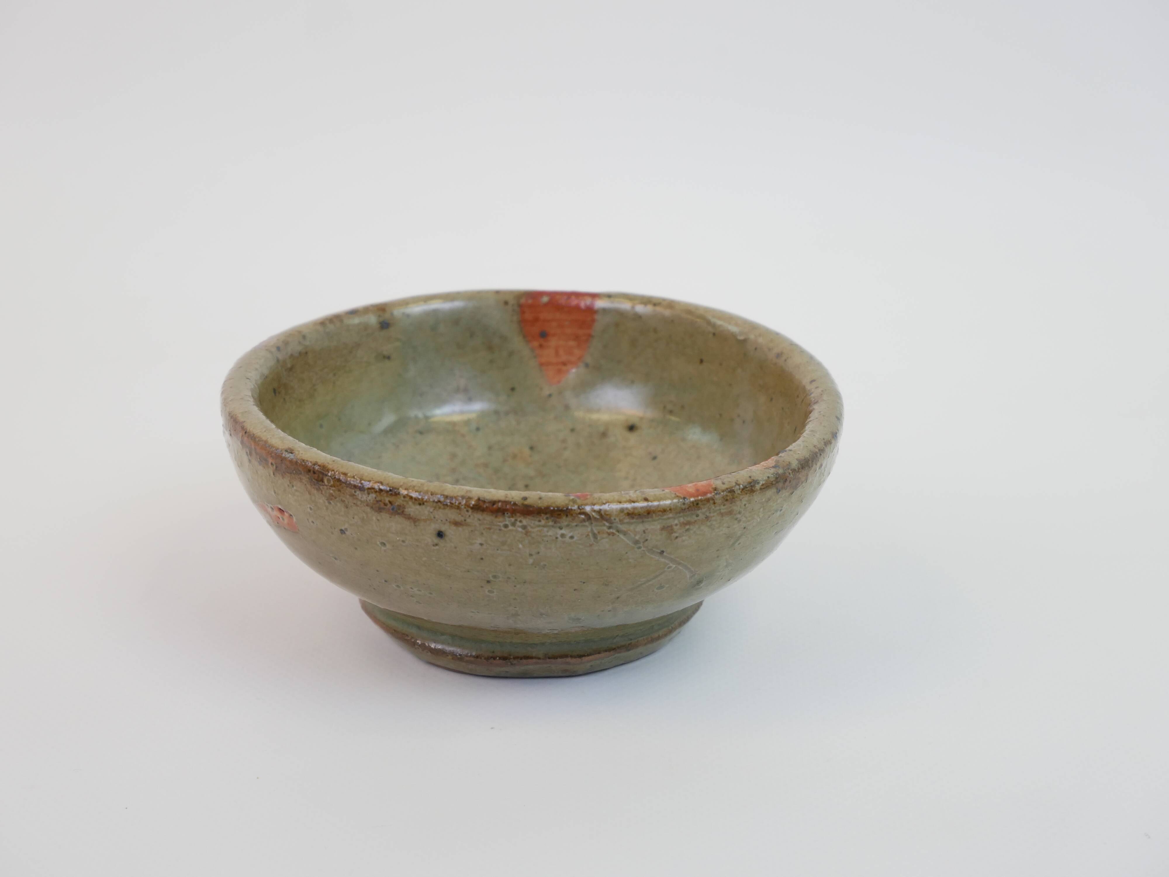 Small bowl in water green glazed ceramic with coral pink pattern