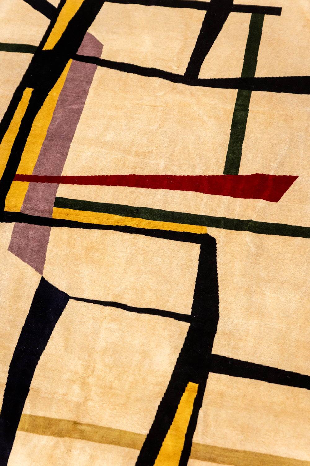 Handwoven wool tapestry with colourful geometric design. 2026.