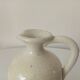 Vintage glazed stoneware pitcher, signed
