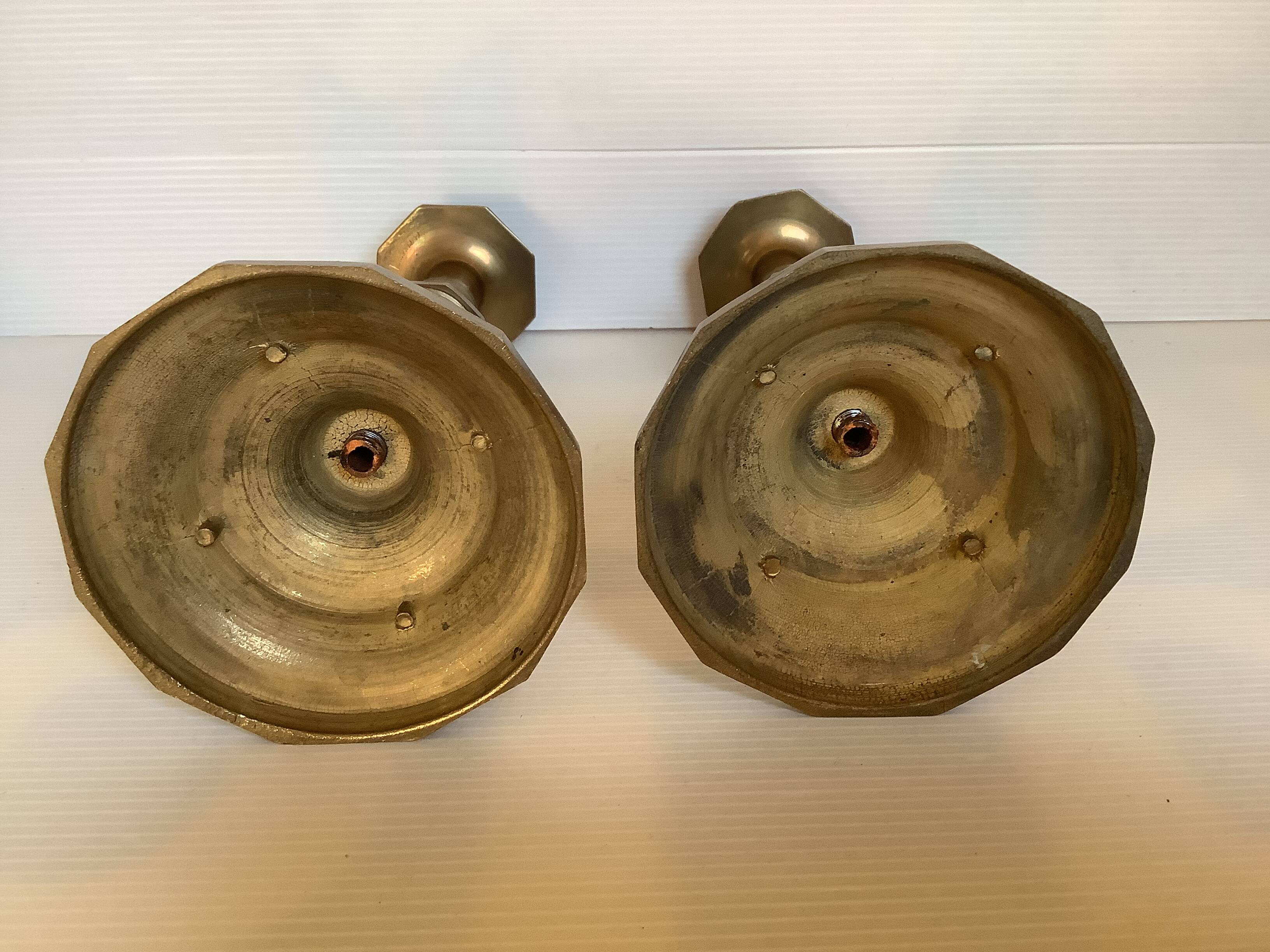 Four brass candle holders