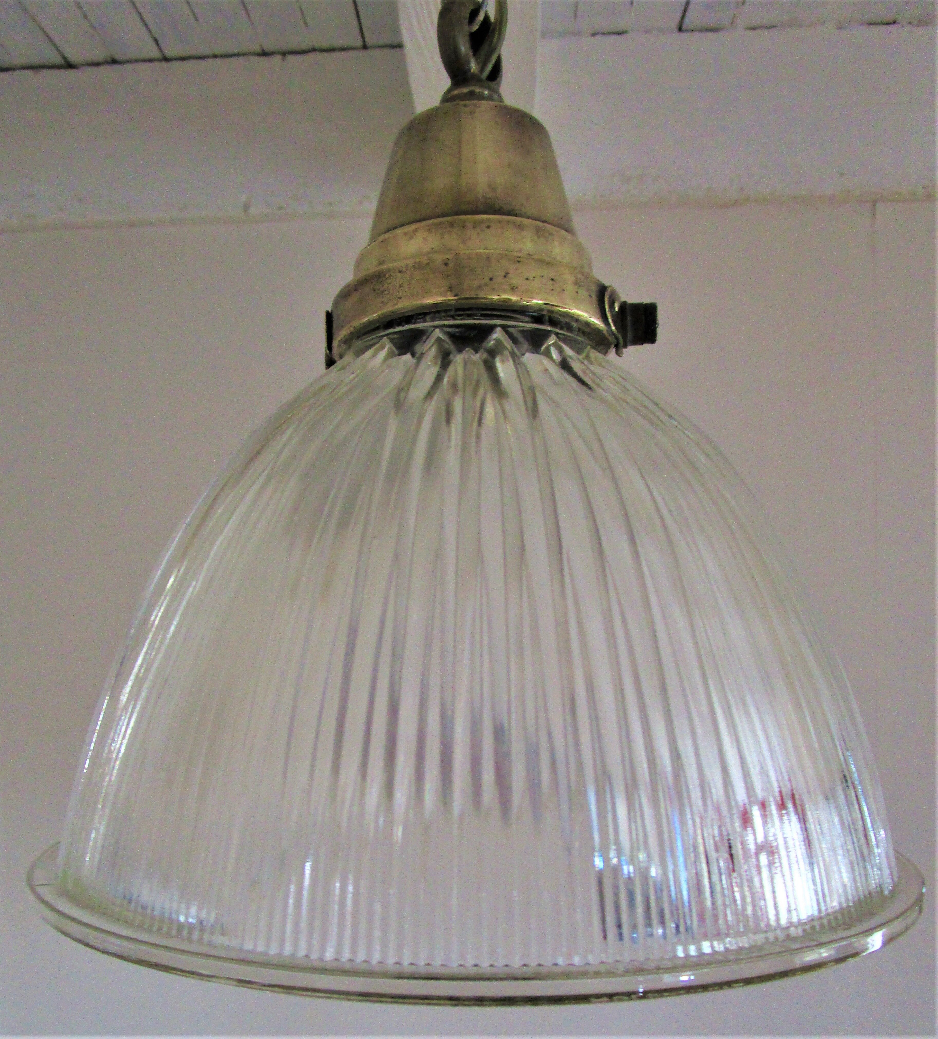 Holophane glass suspension and vintage patinated brass