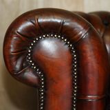 Pair of restored antique Chesterfield sofas in Boudreaux leather.